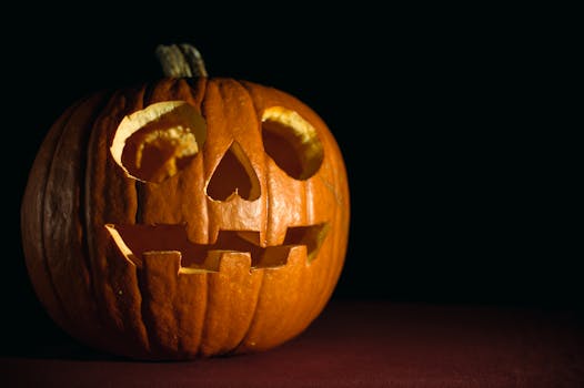 Close-up of a glowing carved pumpkin, perfect for Halloween themes.